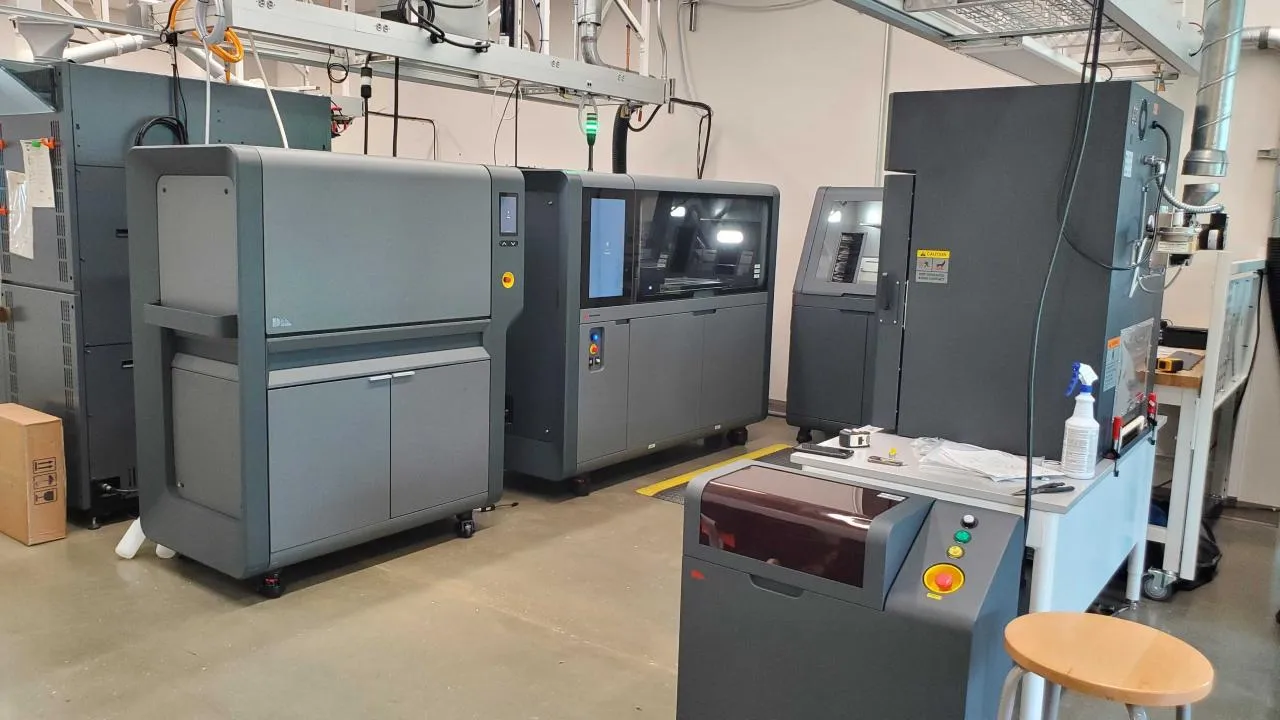 Industrial 3D printers, including the Desktop Metal Shop metal binder jetting system, inside the Terrapin Works fabrication lab